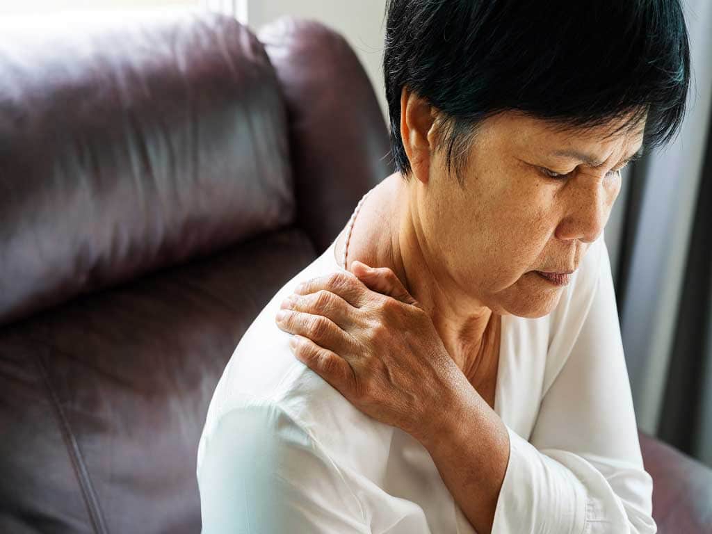 An elder woman with shoulder pain