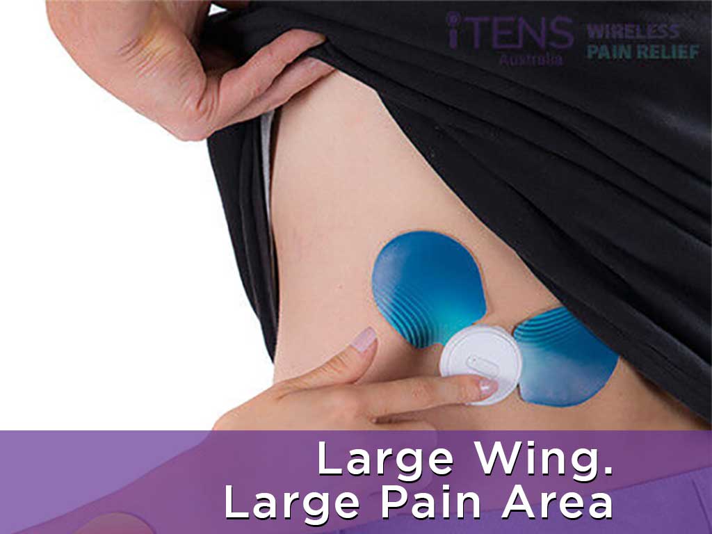 Pad placement of TENS machine on one side of the back