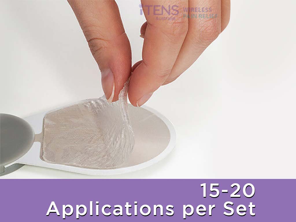 A hand peeling off the plastic backing of iTENS gel pad