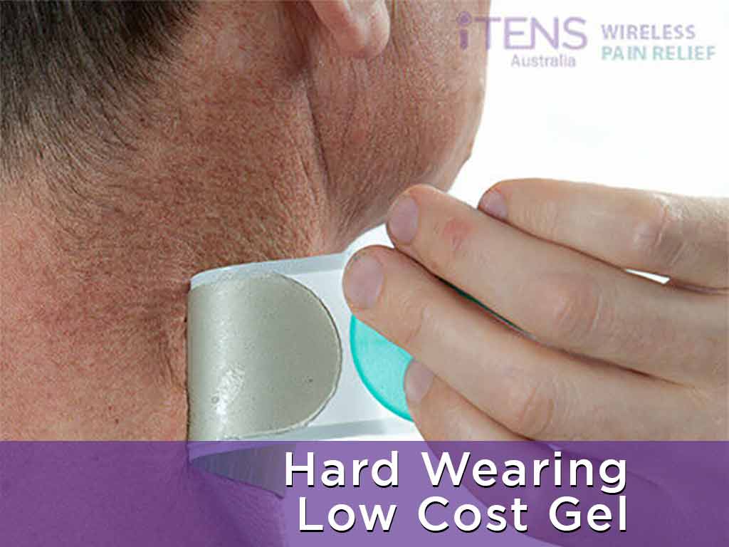 A person peeling off the iTENS on his neck.